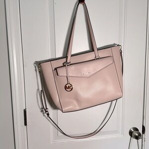 Michael Kors pink 3-in-1 tote with wristlet and clutch.